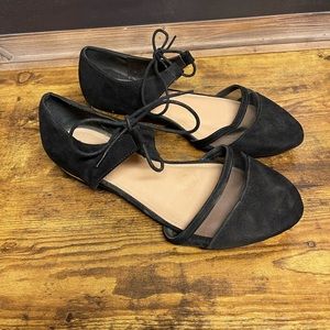 Black flats with gold accent heel